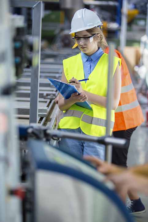 woman quality control worker in factory